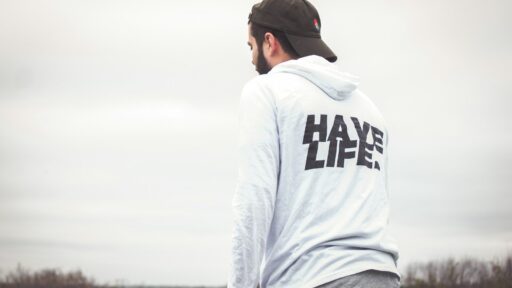 man in white and black hoodie and black cap